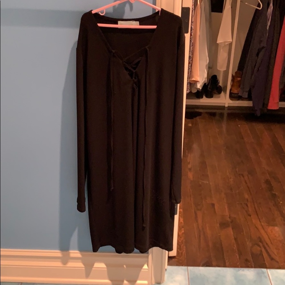 Black long sleeve dress with criss cross tie.
